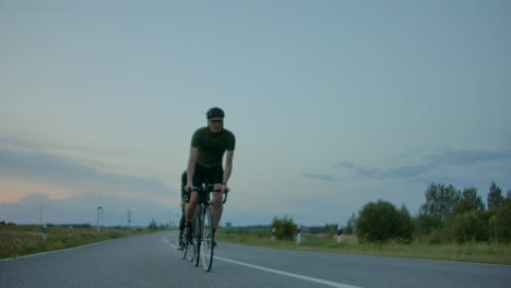 Cyclists-Riding-On-Country-Road